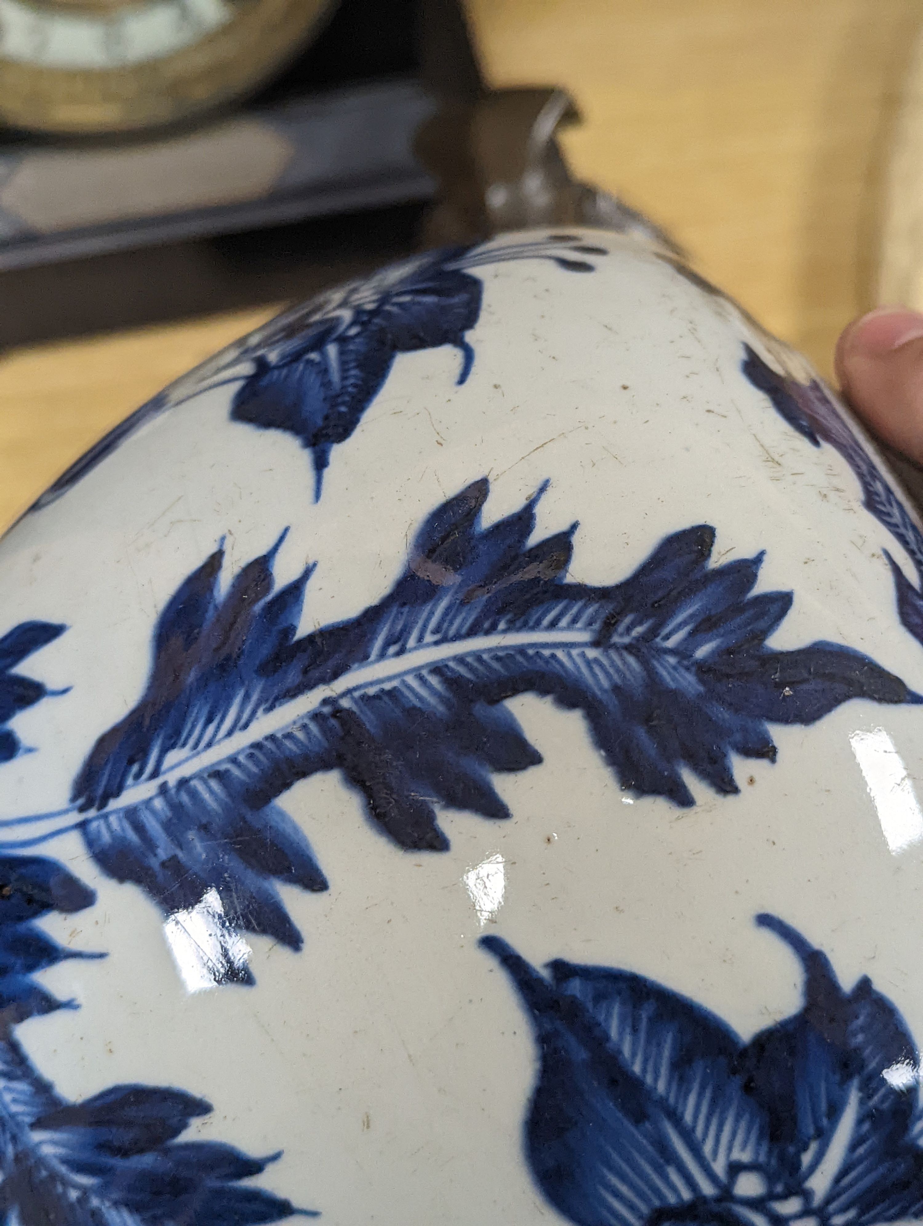 A 18th/19th century Chinese blue and white jar and wood cover - 22cm high